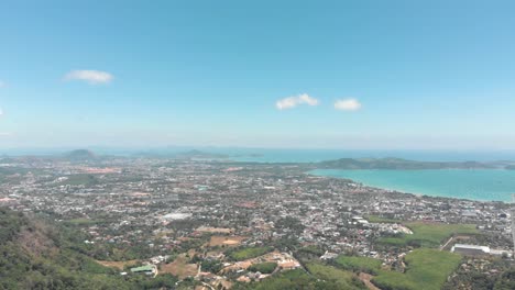 Top-wide-view-over-Mueang-Phuket-District-urbanised-tropical-landscape-in-Phuket,-Thailand---Aerial-Wide-top-panoramic-view