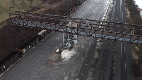 Drone-pan-around-an-old-metal-bridge-over-rail-tracks
