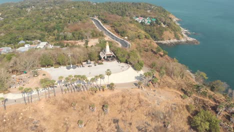 Temple-Shrine-of-Lord-Brahma-and-Light-House-in-Promthep-Cape-in-Phuket,-Thailand---Aerial-Panoramic-Wide-shot