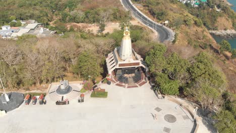 Temple-Light-House-next-to-Promthep-Cape-in-Phuket,-Thailand---Aerial-Ascending-Dronie-survey-shot