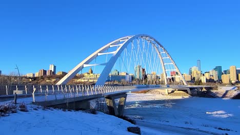 Stunning-Twilight-Loop-Time-Lapse-sunset-Post-Modern-Walter-Dale-Bridge-Winter-Sunny-frozen-North-Saskatchewan-River-family-couple-out-for-a-walk-on-a-clear-blue-skies-sunshine-lovely-city-skyline-1-4