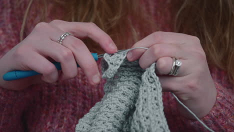 Woman-Knits-With-Crochet-At-Home---Female-Hands-With-Hook-And-Yarn---close-up