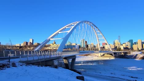 Stunning-Twilight-Loop-Time-Lapse-sunset-Post-Modern-Walter-Dale-Bridge-Winter-Sunny-frozen-North-Saskatchewan-River-family-couple-out-for-a-walk-on-a-clear-blue-skies-sunshine-lovely-city-skyline-2-4