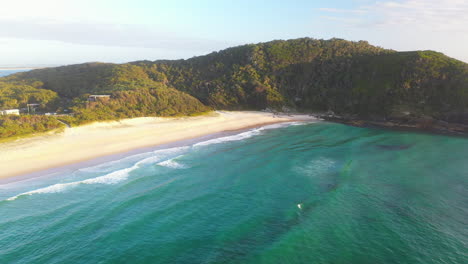 Aerial-view-of-idyllic-Australian-beach-and-turquoise-coastal-bay