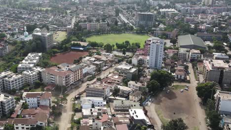 Aerial-View-of-West-Nairobi,-Kenya,-Residential-Neighborhood-and-Green-Circular-Park-on-Sunny-Day,-60fps-Drone-Shot