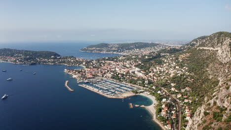 Aerial-view-of-port-and-beautiful-coastline-with-buildings-during-sunny-day