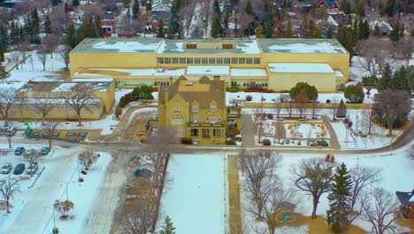Aerial-Winter-semi-circle-around-the-quiet-Government-House-with-the-old-Royal-Alberta-Museum-designated-by-Her-Majesty-Queen-Elizabeth-II-on-May-24th-2005-in-Celebration-of-Alberta's-Centennial-1-6