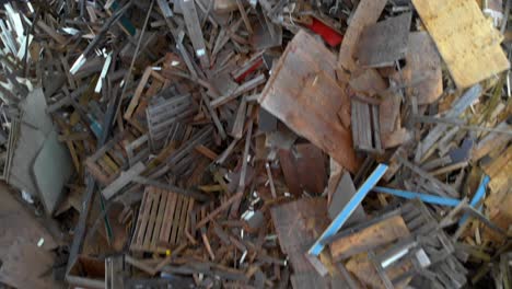 Aerial-Flyover-Of-Junk-Wooden-Pellets-And-Construction-Materials-At-A-Garbage-Dump
