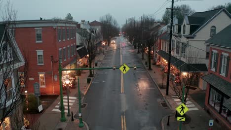 Rising-aerial-reveals-small-town-America,-decorated-with-Christmas-lights