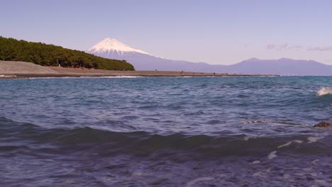 Low-angle-view-of-Mount-Fuji-with-ocean-and-beach-at-famous-Miho-no-Matsubara