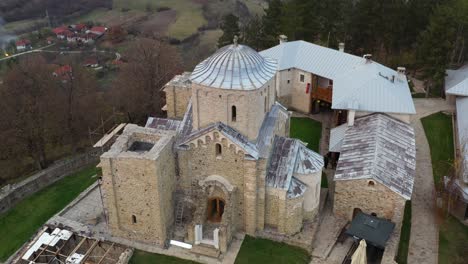 Aerial-shot-circling-around-the-ancient-monastery-of-Djurdjevi-Stupovi-in-southwestern-Serbia