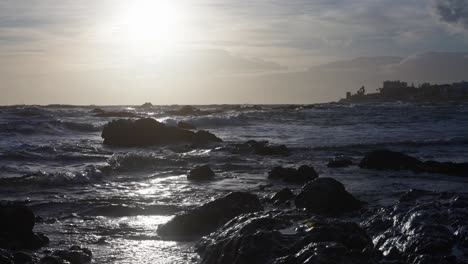 Sun-shining-over-the-rocky-beach-in-slow-motion