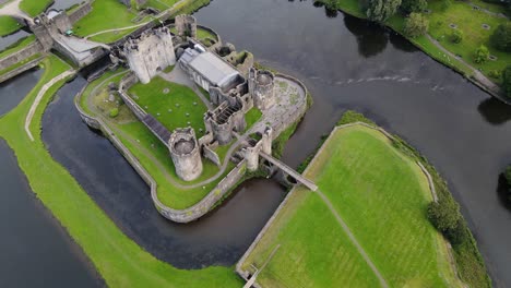 Aerial-view-on-biggest-castle-in-Wales-in-Caerphilly-Castle,-United-Kingdom