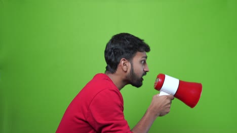 man-shouting-with-a-megaphone-over-a-green-screen-background
