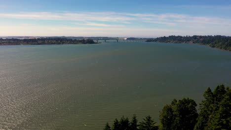 Coos-Bay-In-Oregon-During-High-Tide-With-Distant-View-Of-McCullough-Memorial-Bridge-In-Background