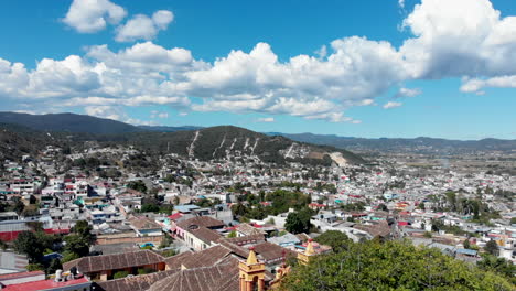 Drone-landing-shot-from-Comitan-de-Dominguez-Chiapas-San-Caralampio-church-kiosko-scenic-cloud-sky-landmark