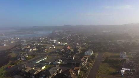 Drone-Flying-Low-Over-Coastal-Homes-In-Bandon,-Oregon---aerial-drone-shot
