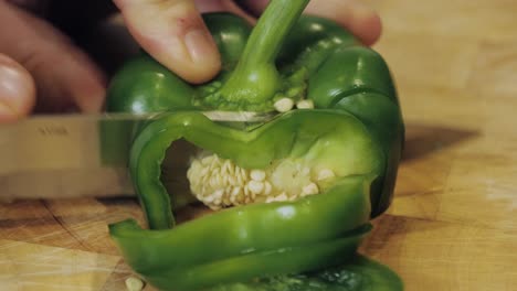 Motion-controlled-slow-motion-shot-of-cutting-green-paprika