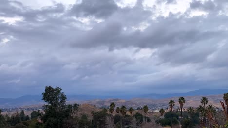 Time-lapse-of-stormy-clouds-over-remote-Californian-mountain-city-suburbs