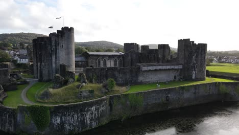 Medieval-fortress-surrounded-by-moat,-Caerphilly-Castle,-Wales