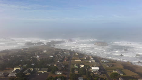 Bird's-Eye-View-Of-Houses-On-Foggy-Bluff-In-Bandon,-Oregon---aerial-drone-shot