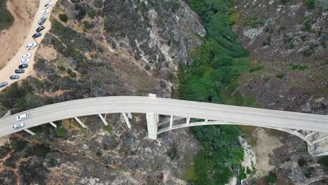 Cars-drive-on-Bixby-Canyon-Bridge-near-Big-Sur-coast-in-California