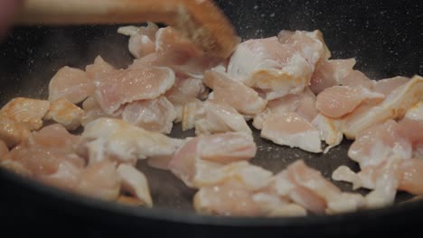 Motion-controlled-shot-of-chicken-meat-in-a-cooking-pan