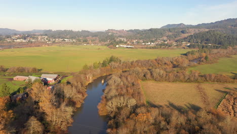 Scenic-Autumn-Landscape-Of-Coquille-River-And-Farmland-In-Myrtle-Point,-Coos-County,-Oregon-At-Daytime---aerial-drone-shot