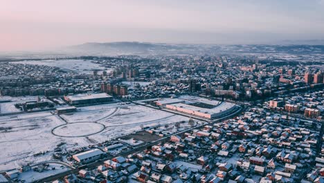 City-under-snow-from-a-drone-perspektive,-Drone-4K