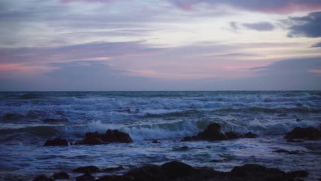 Ocean-waves-at-the-rocks-with-colourful-sky