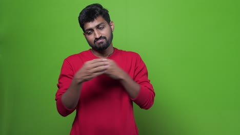 Angry-young--bearded-Indian-man-with-red-tshirt