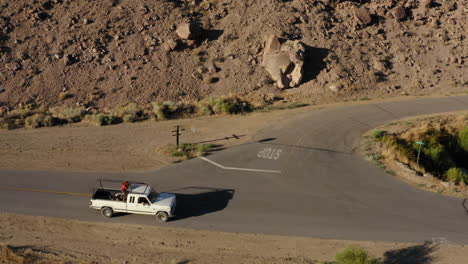 Flight-over-the-Desert-then-chasing-a-car-along-a-road-through-the-bleak-landscape