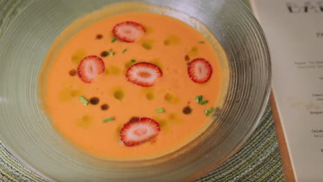 Close-up-of-a-lovely-Spanish-soup-with-slices-of-strawberries,-prepared-in-a-restaurant