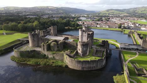Birds-fly-by-picturesque-Caerphilly-Castle-in-Wales-aerial-view