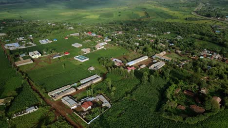 Aerial-view-of-a-village,-on-the-countryside-of-Kenya,-Africa---rising,drone-shot