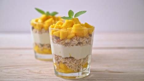 fresh-mango-yogurt-with-granola-in-glass---healthy-food-style
