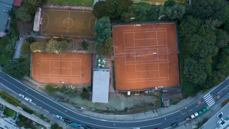 top-down-view-of-some-soccer-and-tennis-playing-fields-from-a-drone