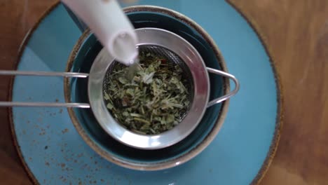 Top-view-of-Pouring-natural-herbal-tea