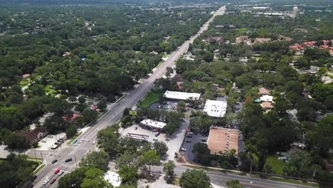 Aerial-forward-reveal-over-Orlando-city-main-road,-Florida