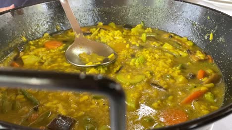 Spanish-soup-rice-paella-with-vegetables-in-slow-motion