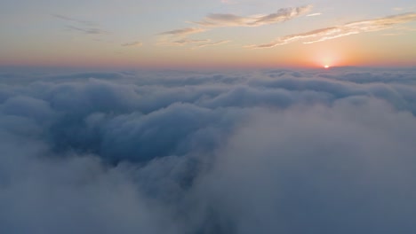 Aerial-view-above-the-clouds-at-the-sunset