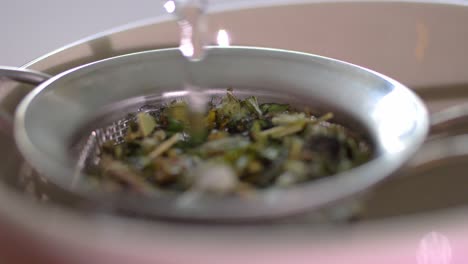 Close-Up-Shot-of-Pouring-natural-organic-herbal-tea