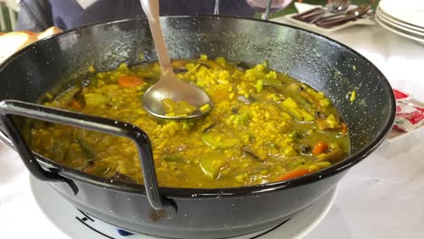 Close-view-of-a-Spanish-soup-rice-paella-in-a-restaurant