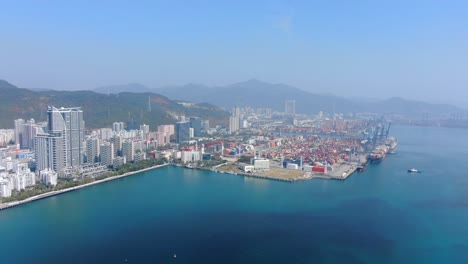 Shenzhen-commercial-Port-terminal-with-docked-Ships-and-Container-yard,-Aerial-view