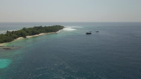 Aerial-Drone-pans-down-over-boats-in-the-maldives-islands