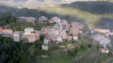 Aerial-view-of-a-little-village-through-the-mountains-in-Italy