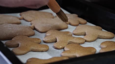 Glazing-gingerbread-cookies-with-a-kitchen-brush
