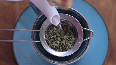 Pouring-natural-herbal-tea