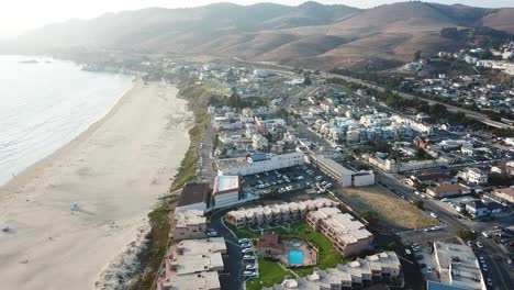 Aerial-forward-over-Pismo-coast-and-sandy-beach,-California