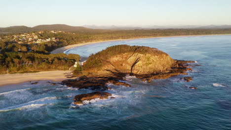 Rotating-drone-shot-of-rocky-outcrop-on-coast-at-Scotts-Head-Austrialia